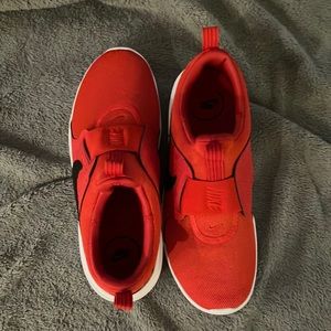 Red Nike gym shoes